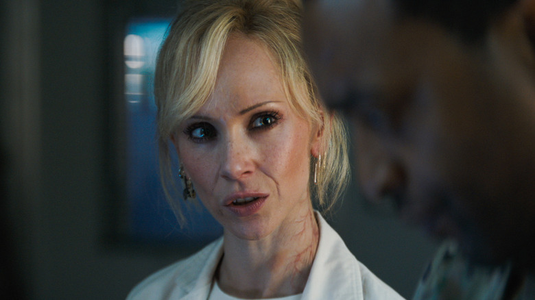 Juno Temple as Dr. Teddy Paine, looking quizzically at another character in Venom: The Last Dance