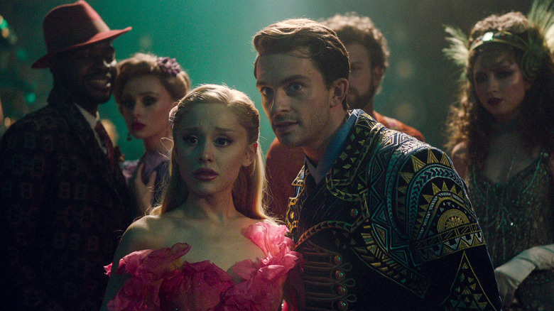 Ariana Grande's Glinda and Jonathan Bailey's Fiyero looking in shock in Wicked