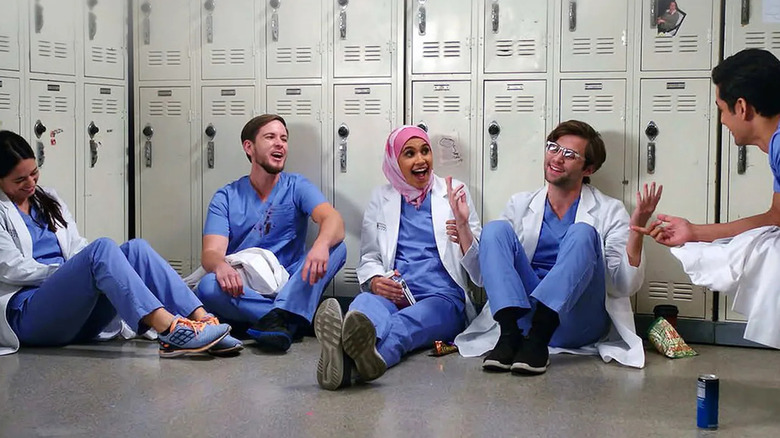 Sam, Casey, Dahlia, Levi, and Vikram in the locker room on Grey's Anatomy: B-Team