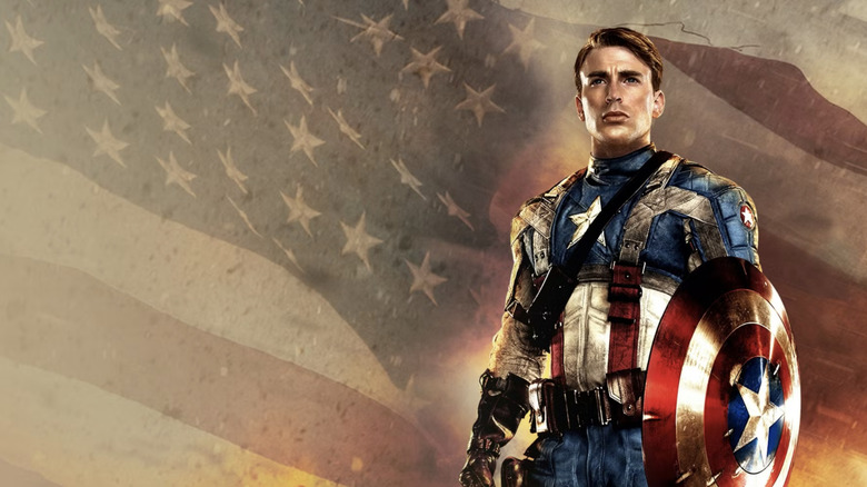  The First Avenger poster featuring Cap standing in front of burning American flag