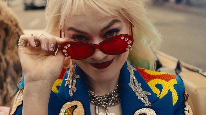 Margot Robbie's Harley Quinn in the car pulling down her glasses at the end of Birds of Prey