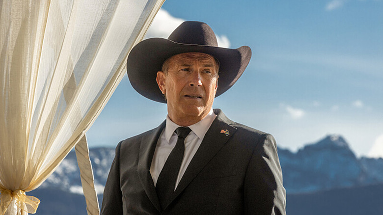 John Dutton in front of a scenic backdrop in Yellowstone