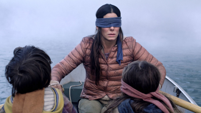 Bird Box Sandra Bullock rows boat blindfolded