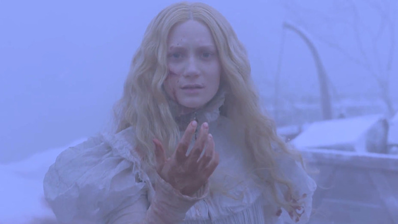 crimson peak woman in white beckons