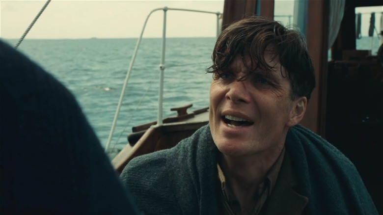 Cillian Murphy bundled up on a boat