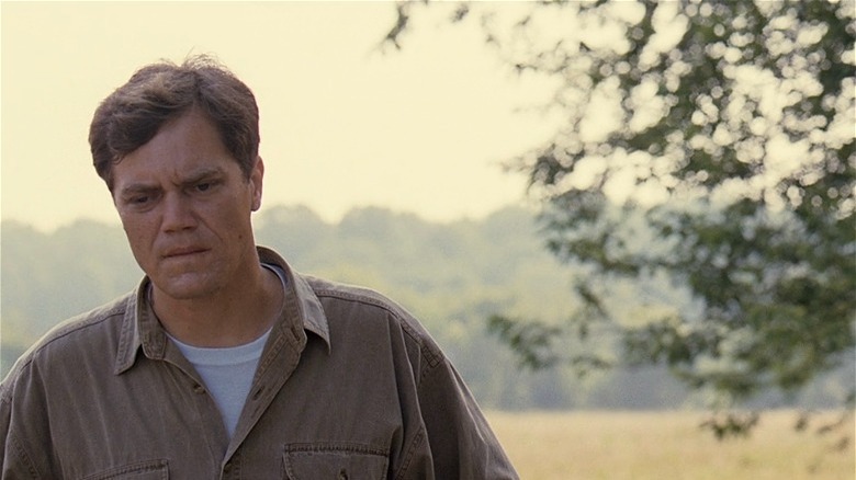 Michael Shannon looking pensive, yellow sky