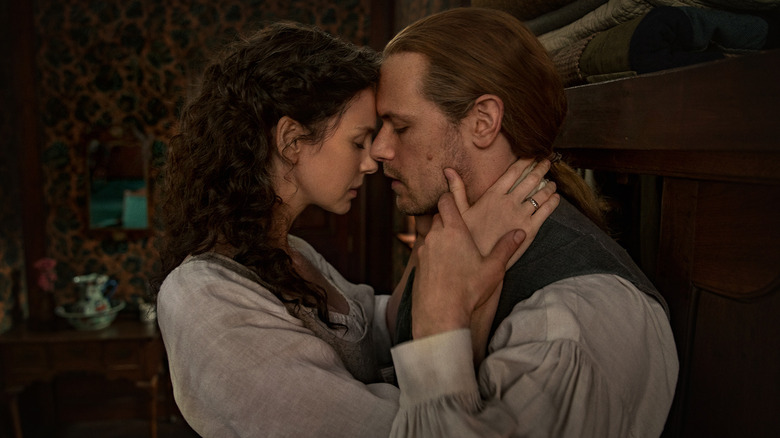 Claire and Jamie embrace on Outlander