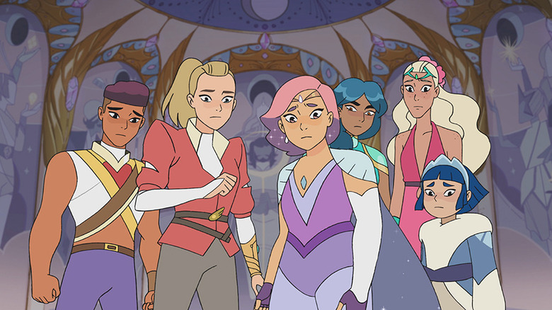 Adora and her friends look concerned.