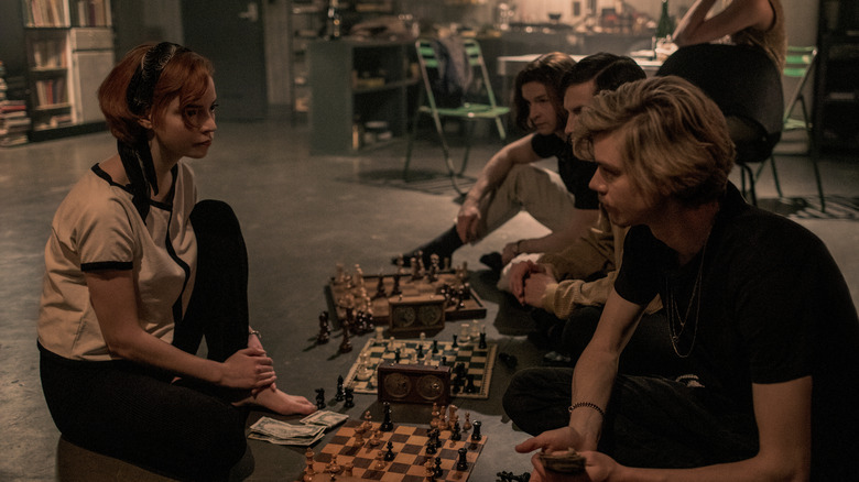 Beth plays some late night chess on The Queen's Gambit