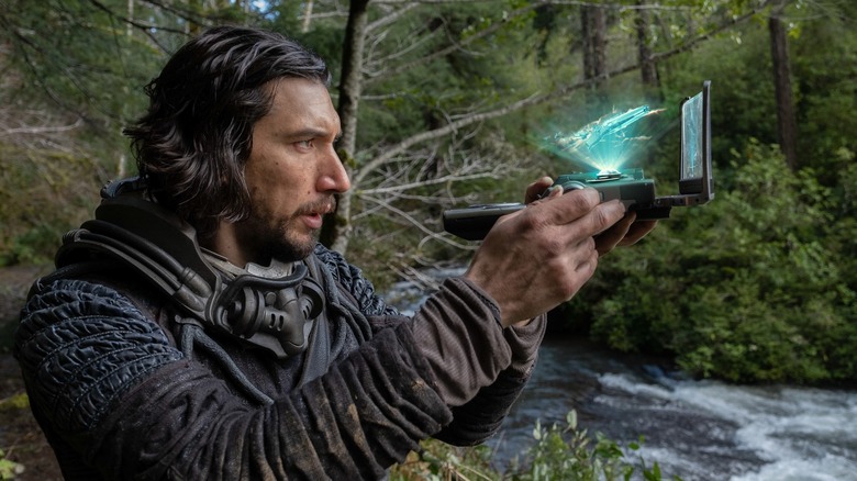 Adam Driver looking at a hologram in 65