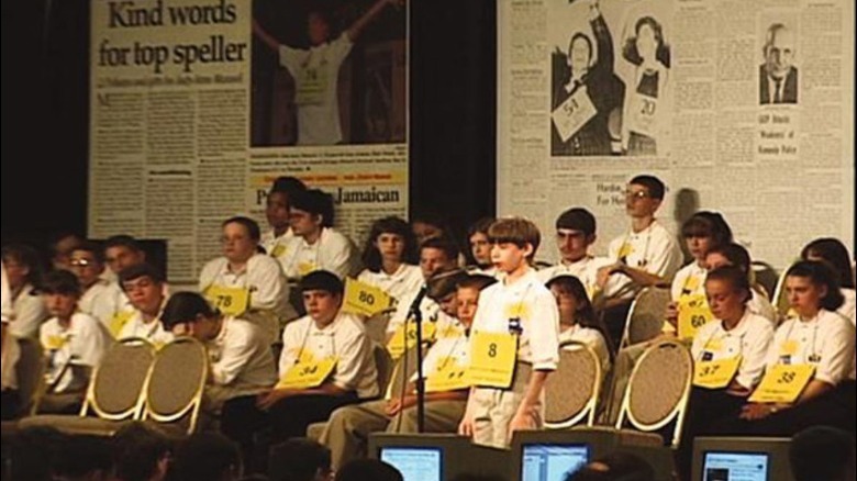 boy at spelling bee spelling