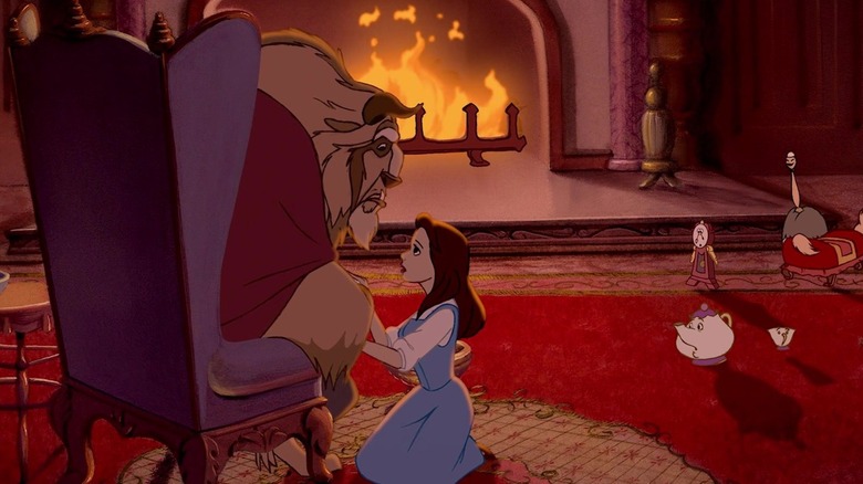 Belle comforts the Beast fireside