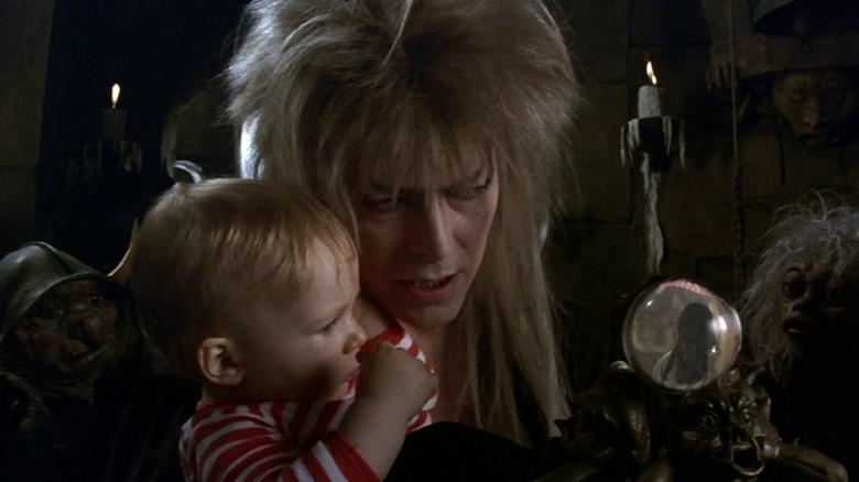 Goblin King holds baby