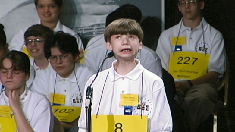 Boy answers at spelling bee