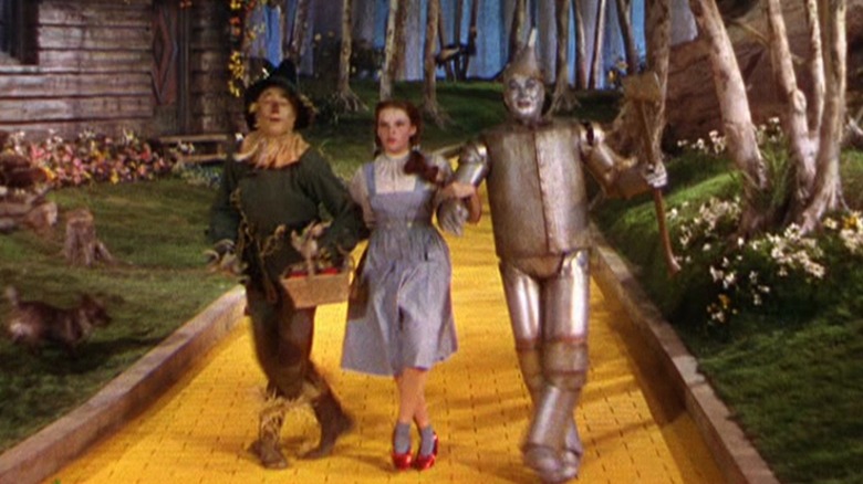 Dorothy, Tinman, Scarecrow on golden brick road