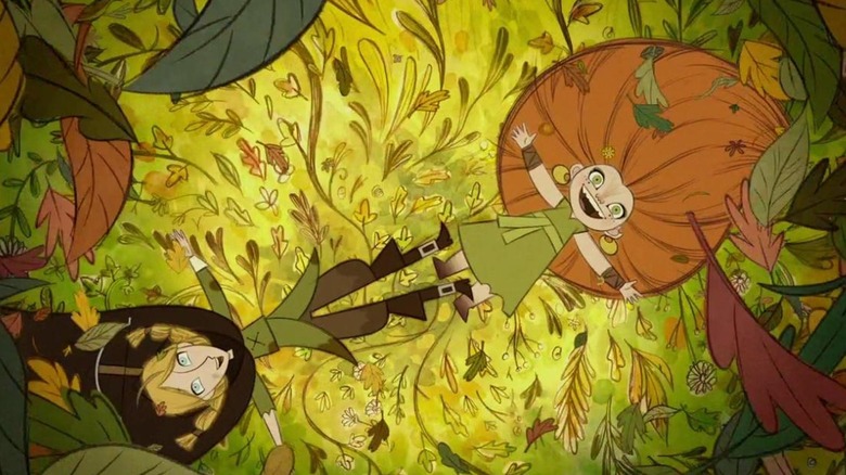 Two girls lay in the leaves