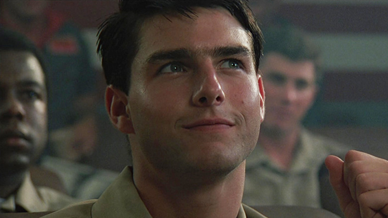 Tom Cruise as Maverick smiling to himself in Top Gun