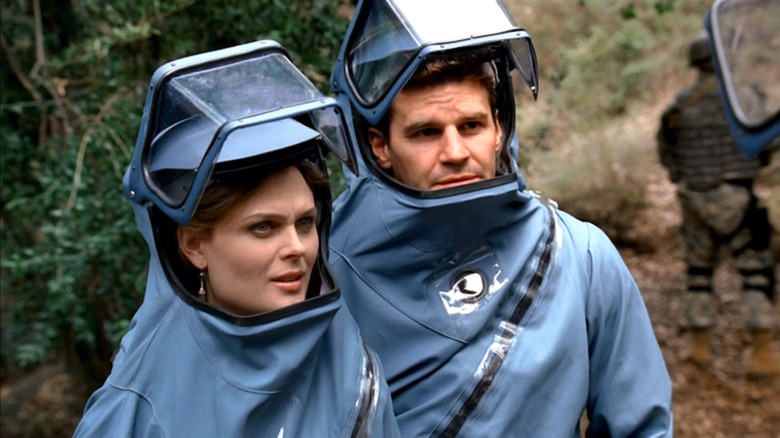 Emily Deschanel and David Boreanaz don hazmat suits in Bones