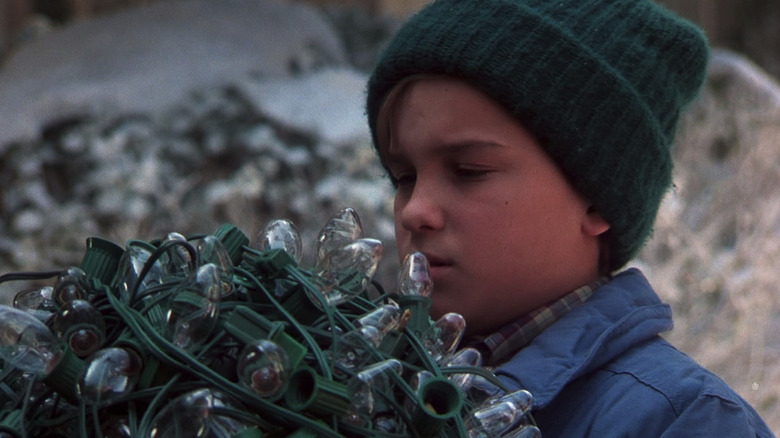 Johnny Galecki as Rusty examines a knot in the lights in Christmas Vacation