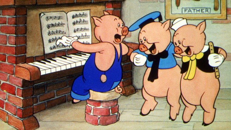 The pigs singing and dancing in Three Little Pigs