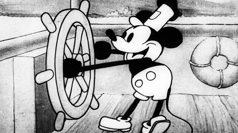 Mickey Mouse steering his steamboat in Steamboat Willie