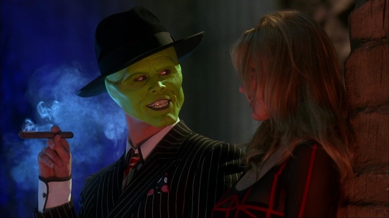 The Mask, smoking a cigar, making eyes at Tina.