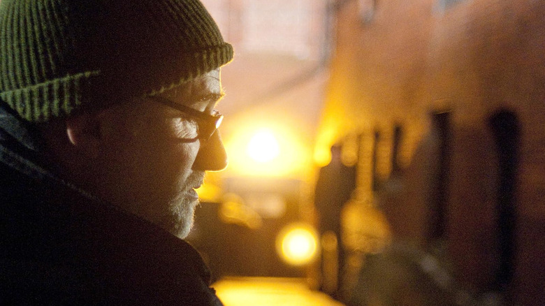 David Fincher wearing a hat on the set of The Social Network