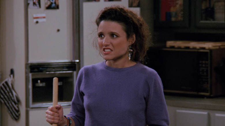 Julia Louis-Dreyfus like Elaine Benes on Seinfeld looks disgusted