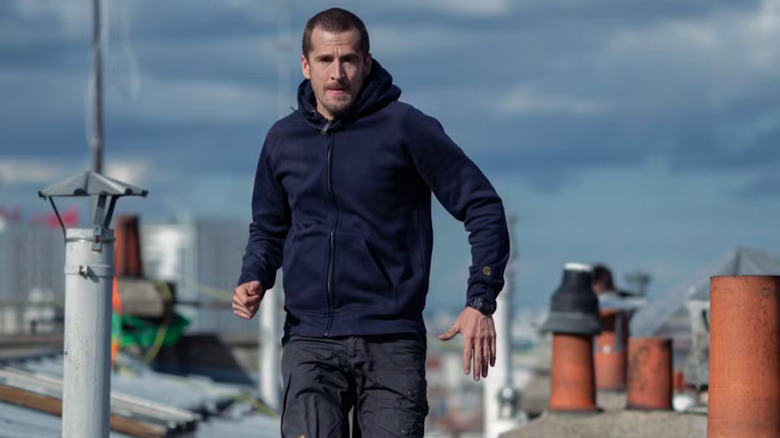 Guillaume Canet runs over rooftops as Franck in Ad Vitam