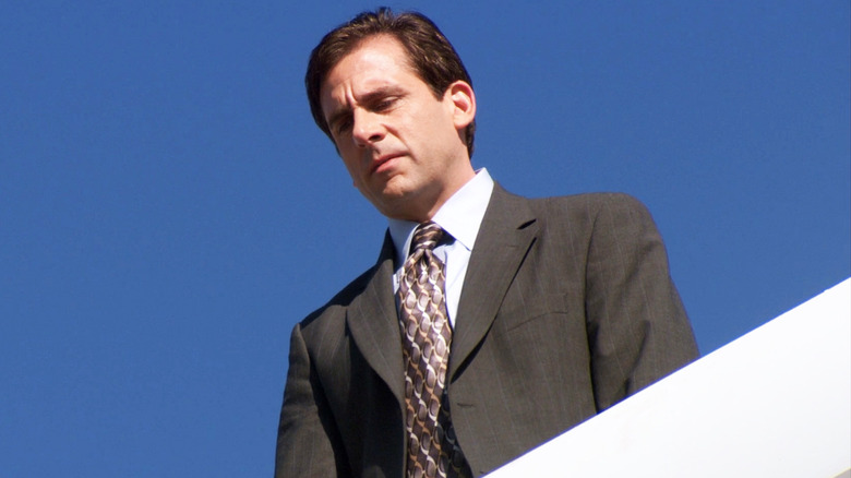 Steve Carrell's Michael Scott looks down from the top of the Dunder Mifflin office block in The Office