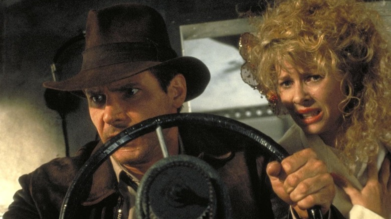 Indiana and Willie Scott struggle to fly a plane in Indiana Jones and the Temple of Doom