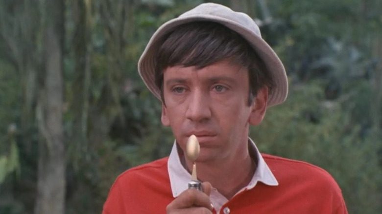 Gilligan holding a spoon up to his face on Gilligan's Island