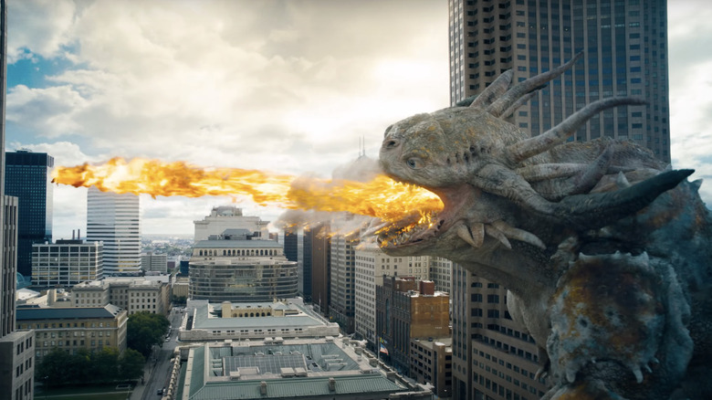 Superman battles a giant kaiju breathing fire in Superman