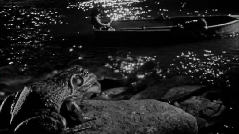 night of the hunter frog and boat by river