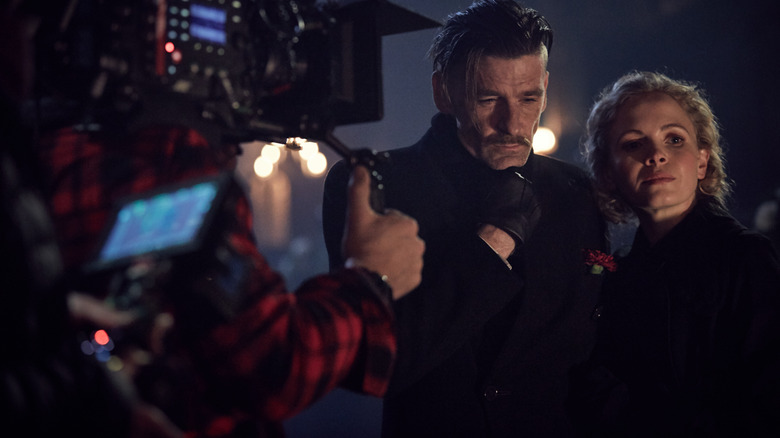 Paul Anderson as Arthur Shelby and Kelly Phillips as Linda Shelby in a behind-the-scenes still from the set of Peaky Blinders