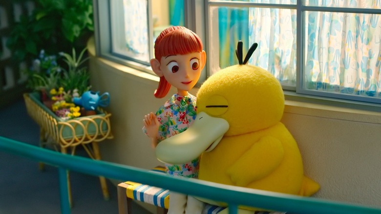 Psyduck cuddles with Haru in Pokémon Concierge