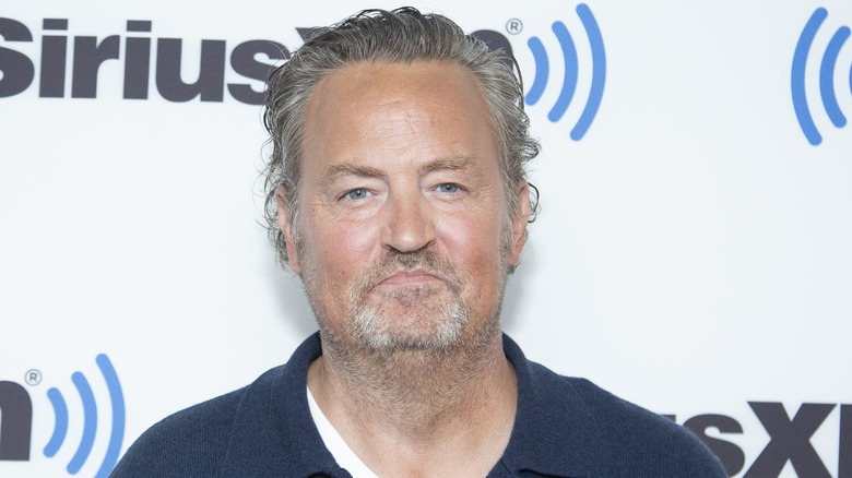 Matthew Perry smirking