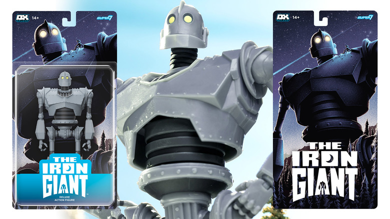 Super7's Iron Giant DELUXE Action Figure in a hero stance between the toy's packaging