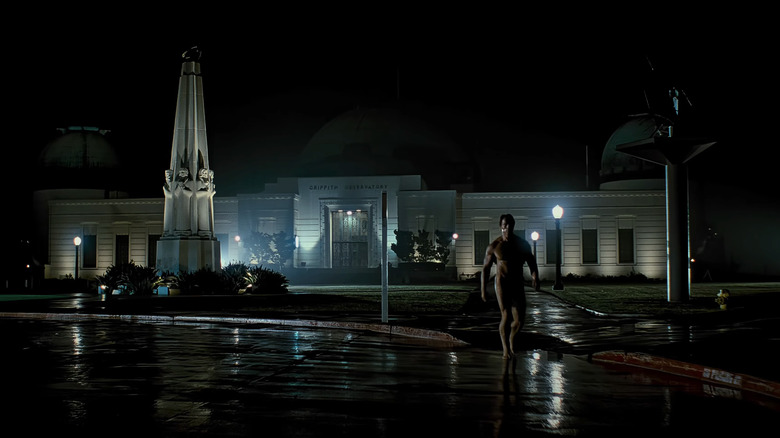 Arnold Schwarzenegger's Terminator walks towards camera with the Griffith Park Observatory in the background in The Terminator