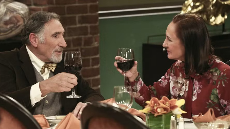 Alfred and Mary raising glasses of wine on The Big Bang Theory