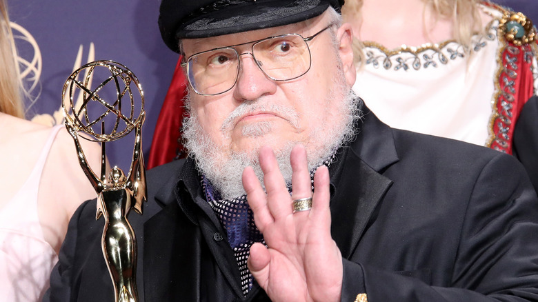 George R. R. Martin holding Emmy