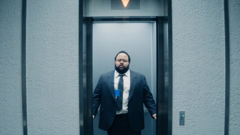 Dylan in the elevator on Severance