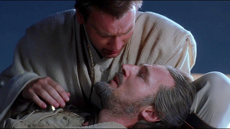 Obi-Wan comforts a dying Qui-Gon in Star Wars Episode I: The Phantom Menace