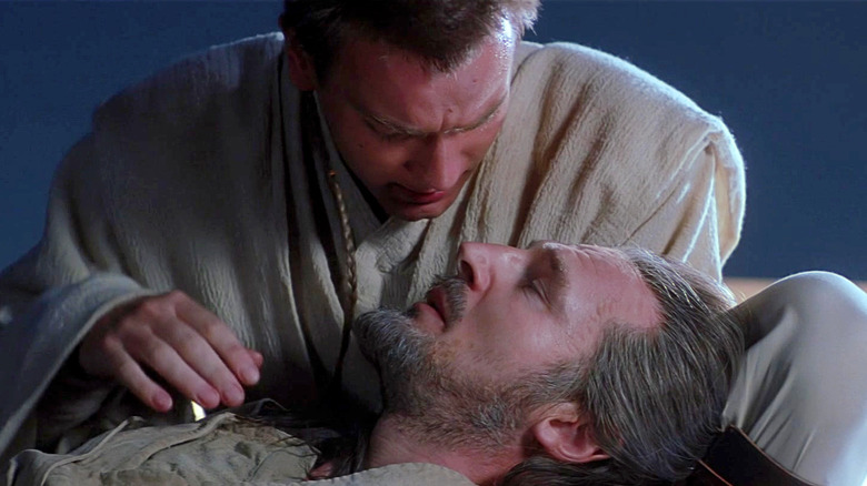 Obi-Wan comforts a dying Qui-Gon in Star Wars Episode I: The Phantom Menace