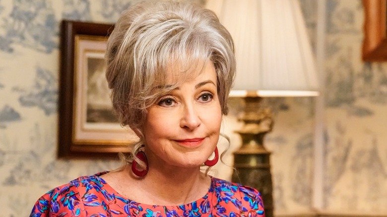 Annie Potts as Connie 'Meemaw' Tucker sitting at the dinner table in Young Sheldon