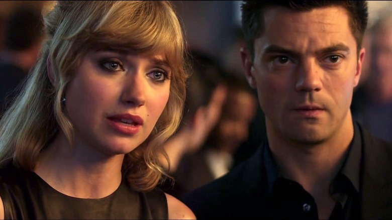 Julia (Imogen Poots) and Dino (Dominic Cooper) look in in concern in Need for Speed