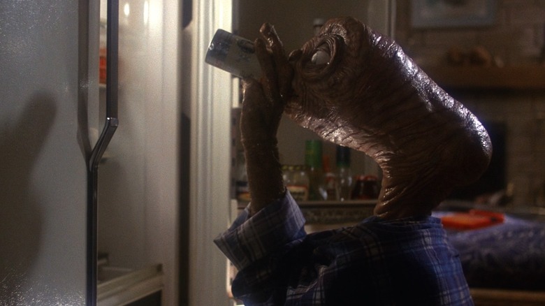 E.T. e.t. has a beer at the fridge