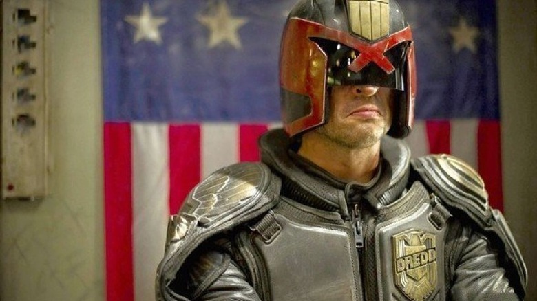 Judge Dredd before a flag