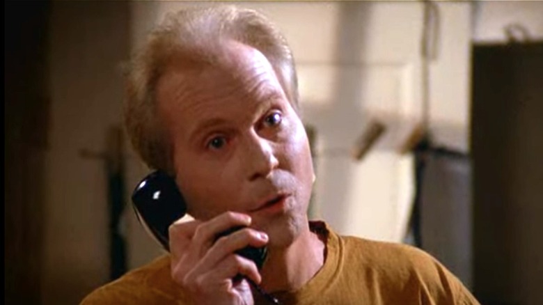 Peter Crombie on telephone as Joe Davola