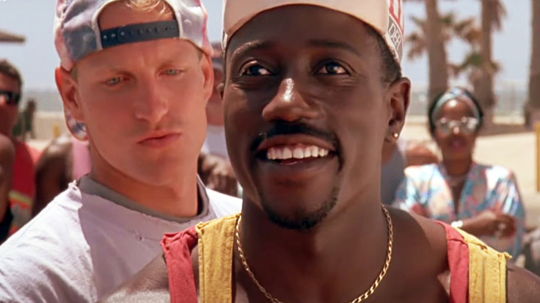 Syd Dean smiling in front of Billy Hoyle, a scene from White Men Can't Jump